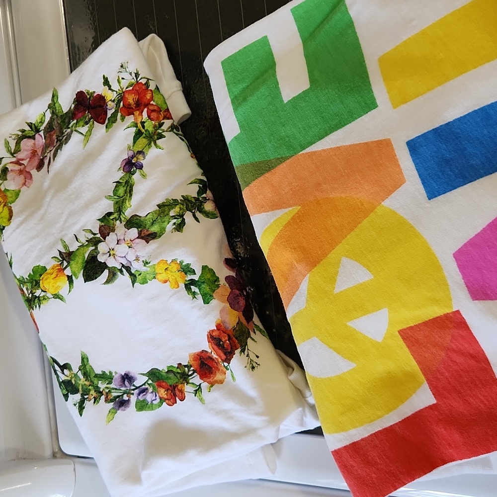 Pair of Never worn love and peace t shirts